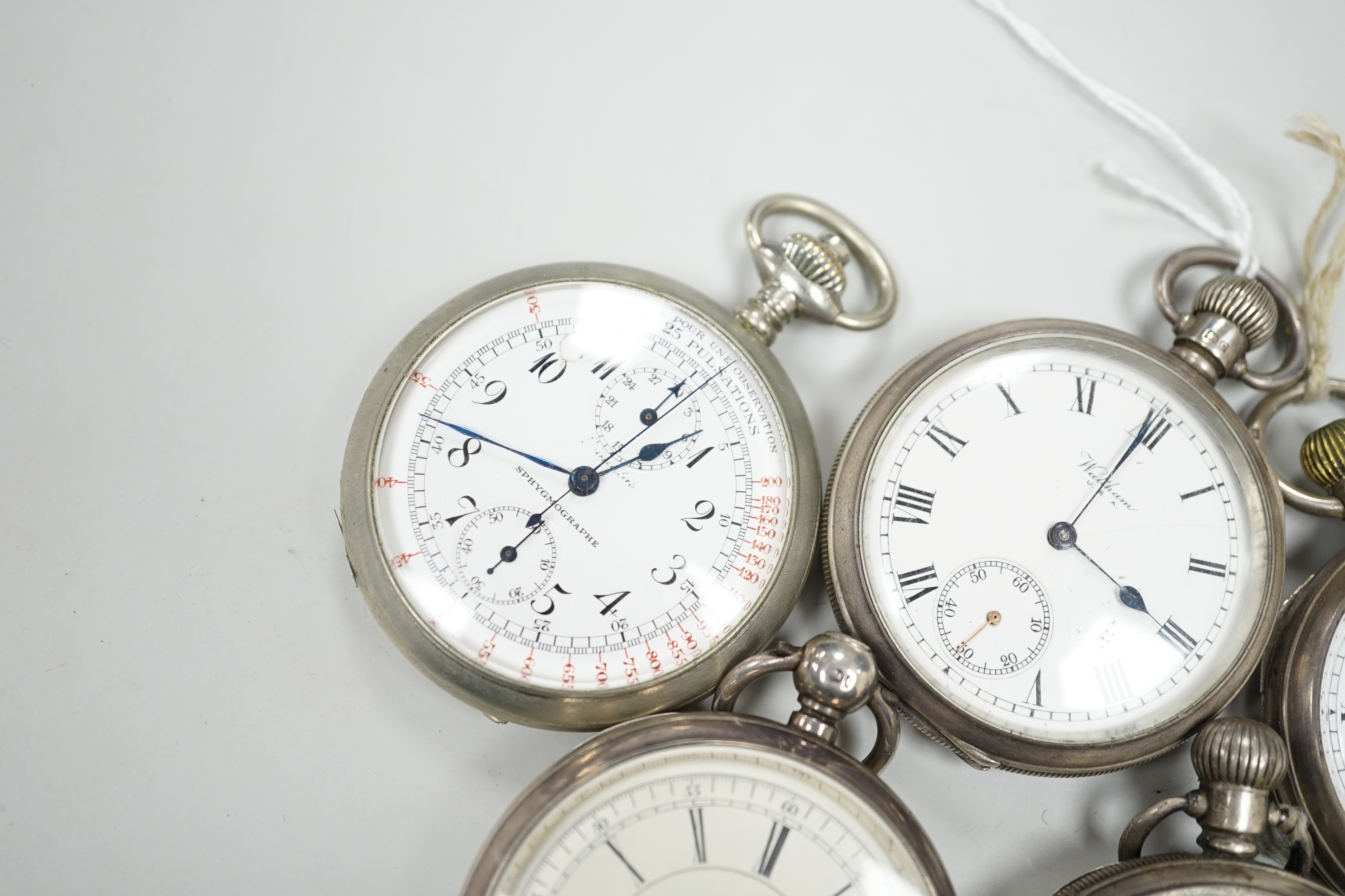 Four assorted silver open faced pocket watches including two Waltham and a J.W. Benson and two other base metal pocket watches.